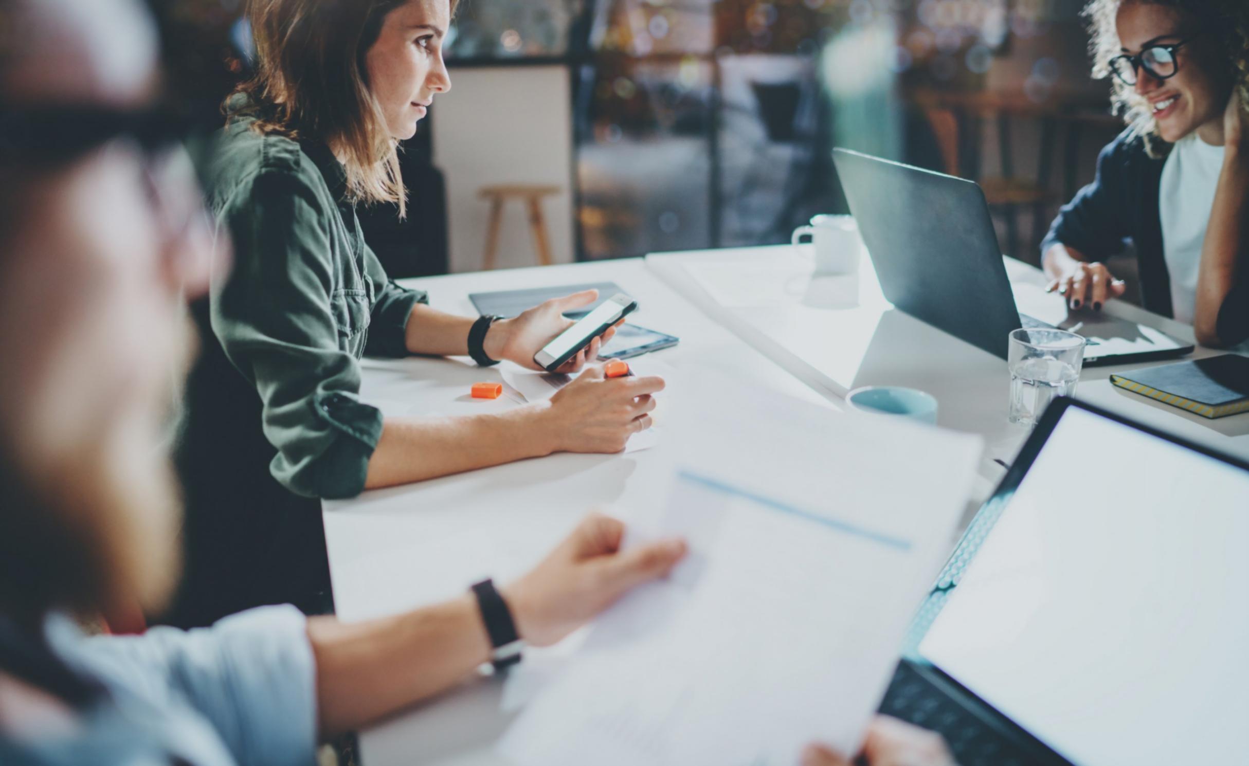Financial analyst reviewing spreadsheet models on computer